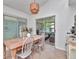Bright breakfast nook with a dining table and views of the backyard at 12327 Glenfield Ave, Tampa, FL 33626