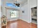 Dining room featuring hardwood floors, large windows, and a view of the backyard at 12327 Glenfield Ave, Tampa, FL 33626