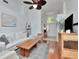 Bright, open living area with hardwood floors, white sofa, modern decor, and a seamless flow to the entryway at 12327 Glenfield Ave, Tampa, FL 33626