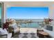 Relaxing balcony with comfortable seating and a beautiful view of the bay and waterfront at 1325 Snell Isle Ne Blvd # 911, St Petersburg, FL 33704