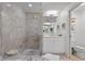 Beautiful bathroom with tiled shower, modern vanity, and toilet, featuring stylish decor and fixtures, and a coastal motif at 1325 Snell Isle Ne Blvd # 911, St Petersburg, FL 33704