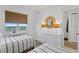 Serene bedroom featuring twin beds, dresser, and a window showcasing scenic views at 1325 Snell Isle Ne Blvd # 911, St Petersburg, FL 33704