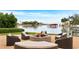 Picturesque outdoor space featuring a cozy fire pit and comfortable seating area overlooking the serene waterfront at 1325 Snell Isle Ne Blvd # 911, St Petersburg, FL 33704