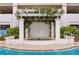 Inviting poolside hot tub enclosed by a pergola with climbing greenery and lush landscaping at 1325 Snell Isle Ne Blvd # 911, St Petersburg, FL 33704