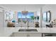 Modern kitchen view with stainless appliances and a stunning view of the ocean in the background at 1325 Snell Isle Ne Blvd # 911, St Petersburg, FL 33704