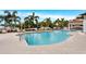 Inviting outdoor pool area with lounge chairs, umbrellas, and a covered patio, perfect for relaxing and entertaining at 1325 Snell Isle Ne Blvd # 911, St Petersburg, FL 33704