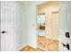 Hallway view into the bedroom featuring carpeted floors and a ceiling fan at 13483 Heritage Way, Sarasota, FL 34240