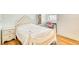 Charming bedroom featuring a stylish bed frame, wood floors, and natural light at 13483 Heritage Way, Sarasota, FL 34240
