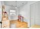 Bright bedroom featuring wood floors, a window, closet, and painted white at 13483 Heritage Way, Sarasota, FL 34240