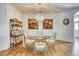 Elegant dining room featuring a chandelier, glass table, and ornate decor at 13483 Heritage Way, Sarasota, FL 34240