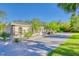 Beautiful one story home with manicured landscaping and a long driveway at 13483 Heritage Way, Sarasota, FL 34240