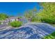 One story home featuring a long driveway, tropical foliage and a two car garage at 13483 Heritage Way, Sarasota, FL 34240