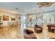 Bright, open-concept living area featuring wood floors, modern kitchen, and comfortable seating at 13483 Heritage Way, Sarasota, FL 34240