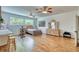 Spacious bedroom features a large window, hardwood floors, ceiling fans and a stylish vanity at 13483 Heritage Way, Sarasota, FL 34240