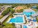 Overhead view of a community swimming pool, splashpad, and sports facilities, ideal for active living and Gathering enjoyment at 1390 S Hillcrest Ave, Clearwater, FL 33756