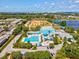 Aerial view of community with pool, splashpad, and baseball field, offering recreational amenities for residents at 1390 S Hillcrest Ave, Clearwater, FL 33756