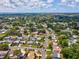 A beautiful aerial view of the home showcases the surrounding neighborhood with mature trees and well-maintained lawns at 1390 S Hillcrest Ave, Clearwater, FL 33756
