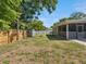 Fully-fenced backyard with storage shed and wood privacy fence at 1390 S Hillcrest Ave, Clearwater, FL 33756