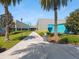 A modern exterior view of the Recreation Complex shows lush landscaping and architectural details at 1390 S Hillcrest Ave, Clearwater, FL 33756