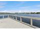 Scenic lake view from the wooden deck, perfect for enjoying the serene waterscape and relaxing outdoors at 1390 S Hillcrest Ave, Clearwater, FL 33756
