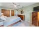 Bedroom featuring a queen bed, ceiling fan and closet space at 1410 Lime St, Clearwater, FL 33756