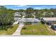 Charming home featuring a well-manicured lawn, driveway, and delightful front porch perfect for relaxing at 1410 Lime St, Clearwater, FL 33756