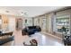 Elegant living room featuring stylish furniture, chic decor, and large windows for natural light creating a welcoming ambiance at 1410 Lime St, Clearwater, FL 33756