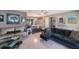 Spacious living area with comfortable seating, contemporary decor, and a dining area creating an inviting atmosphere at 1410 Lime St, Clearwater, FL 33756