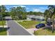 Charming home with a well-manicured lawn, mature trees, and a paved driveway, all in a Gathering-friendly neighborhood at 1410 Lime St, Clearwater, FL 33756