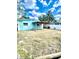 The backyard includes a wooden pergola attached to the house, creating an inviting outdoor space at 1734 Maryland Ne Ave, St Petersburg, FL 33703