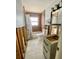 Damaged bathroom with a toilet, sink, shower with curtain and window at 1734 Maryland Ne Ave, St Petersburg, FL 33703