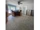 Tile floored kitchen area with a dark countertop and wood cabinets awaiting renovation at 1734 Maryland Ne Ave, St Petersburg, FL 33703