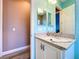 Cozy bathroom with stylish granite countertops, tiled flooring, and light fixtures at 1803 Pacific Dunes Dr, Sun City Center, FL 33573