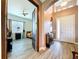 Inviting foyer with tiled floors leading to a bedroom, showcasing a welcoming entrance at 1803 Pacific Dunes Dr, Sun City Center, FL 33573
