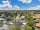 Aerial shot featuring a serene neighborhood, showcasing the home's screened-in pool and peaceful surroundings at 186 Dan River Dr, Spring Hill, FL 34606