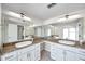 Bathroom features double sinks, a make-up table, plenty of cabinetry, and an arched entrance at 186 Dan River Dr, Spring Hill, FL 34606