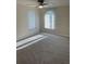 Bedroom with carpet flooring, ceiling fan, and natural light from dual windows at 186 Dan River Dr, Spring Hill, FL 34606
