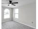 Bedroom featuring a ceiling fan, window and carpet at 186 Dan River Dr, Spring Hill, FL 34606