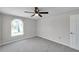 Bedroom featuring a ceiling fan and arched window at 186 Dan River Dr, Spring Hill, FL 34606