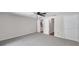 Bedroom featuring neutral carpeting with open bathroom and closet doorways at 186 Dan River Dr, Spring Hill, FL 34606