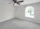 Bedroom featuring a ceiling fan, carpet, and window at 186 Dan River Dr, Spring Hill, FL 34606