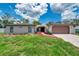 Charming home featuring a two-car garage, arched entryway, and well-maintained landscaping at 186 Dan River Dr, Spring Hill, FL 34606