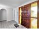 Foyer showcasing stylish wood door with decorative glass panels and new flooring at 186 Dan River Dr, Spring Hill, FL 34606