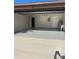 Spacious garage with painted floor, utility sink, and two entry doors, offering functionality at 186 Dan River Dr, Spring Hill, FL 34606
