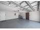 Clean and spacious garage with epoxy flooring, laundry sink and water heater at 186 Dan River Dr, Spring Hill, FL 34606