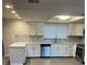 Modern kitchen featuring white cabinets, stainless steel appliances, and quartz countertops at 186 Dan River Dr, Spring Hill, FL 34606