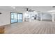 Open floor plan with updated kitchen, stainless appliances, and modern finishes at 186 Dan River Dr, Spring Hill, FL 34606