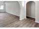 Open living space featuring arched doorways, neutral walls, and modern flooring at 186 Dan River Dr, Spring Hill, FL 34606