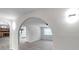 Open living space featuring arched doorways, neutral walls, and modern flooring at 186 Dan River Dr, Spring Hill, FL 34606