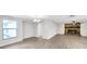 Spacious living room with stone fireplace, hardwood floors, and great natural light at 186 Dan River Dr, Spring Hill, FL 34606